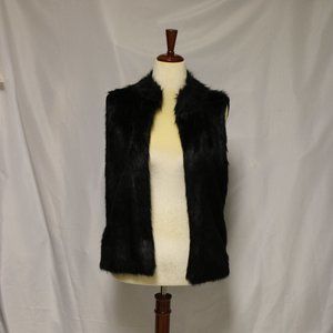 Make a statement with this luxurious Black Faux Fur Sweater Vest!